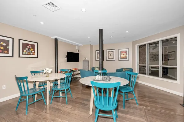 a kitchen with a table and chairs in it