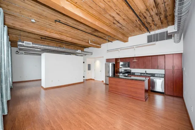 a view of a kitchen with a sink and a stove top oven