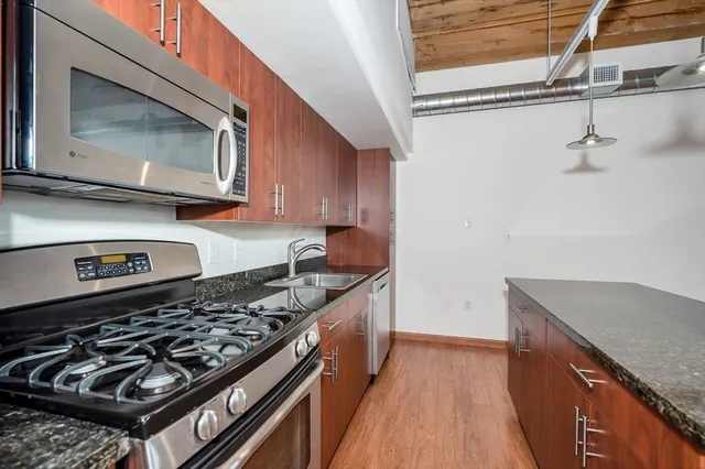 a kitchen with a stove and a microwave
