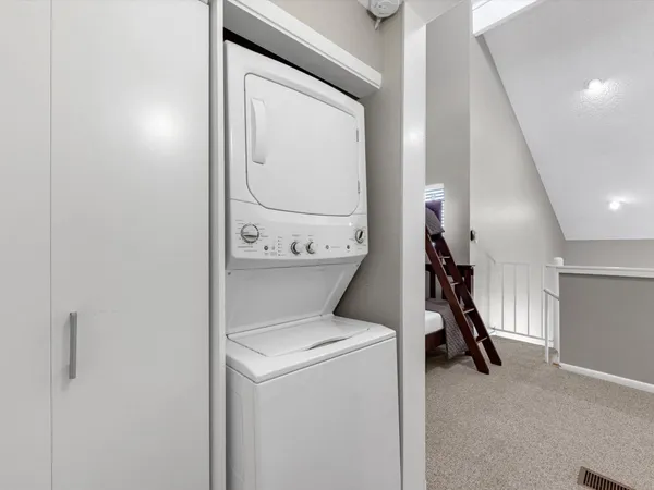 a view of storage and utility room with washer and dryer