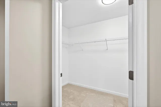 a view of a hallway with washer and dryer