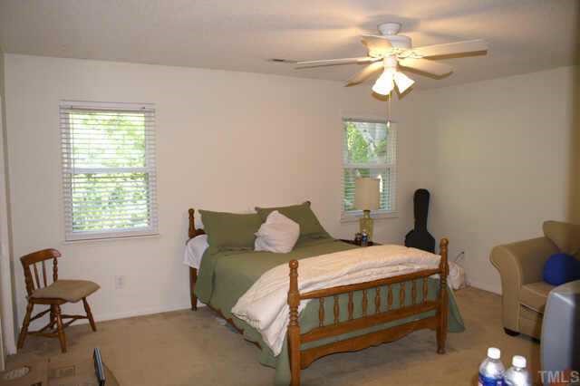 5454 Pine Top Circle Raleigh, NC 27612 - Photo 8 of 10 a bedroom with a bed and a window