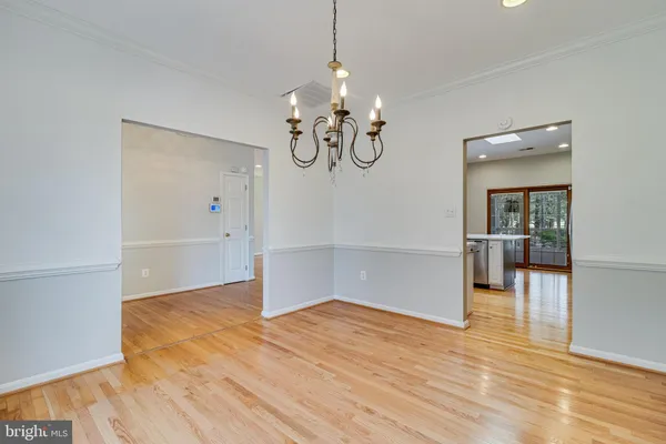 a view of a livingroom with a ceiling fan and window