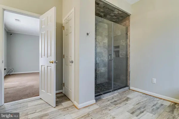 a view of an empty room with a window