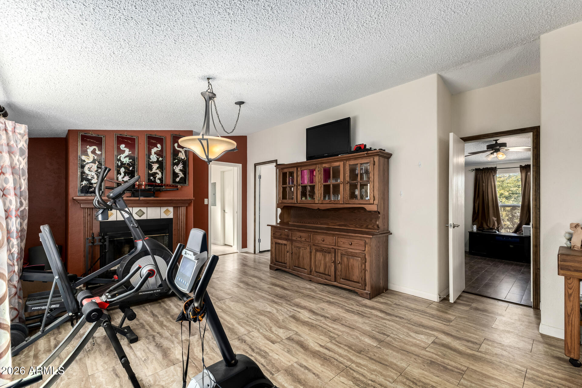 9987 North Geronimo Drive Casa Grande, AZ 85122 - Photo 18 of 53 a view of a workspace with furniture and wooden floor