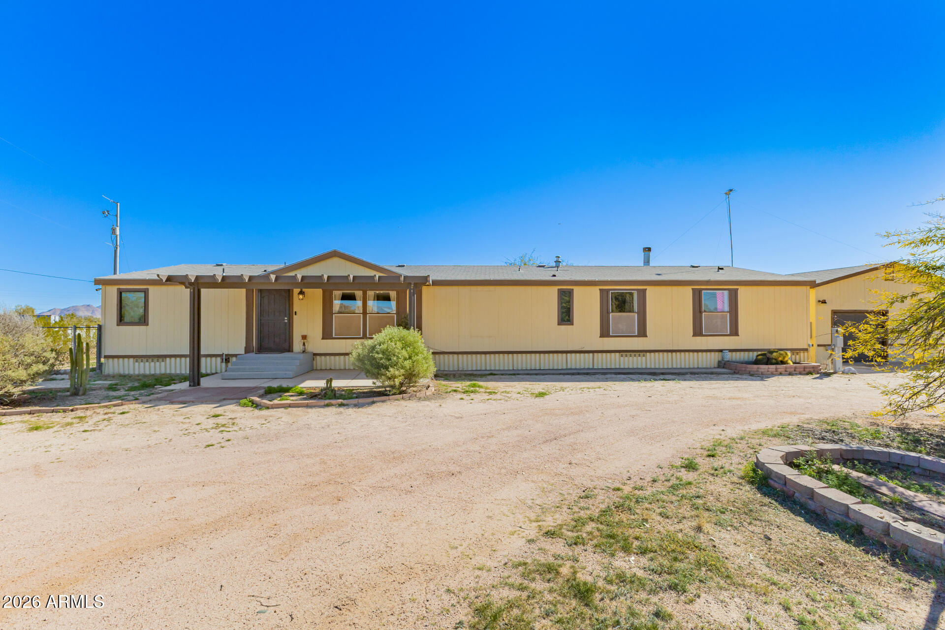 9987 North Geronimo Drive Casa Grande, AZ 85122 - Photo 2 of 53 a front view of a house with a yard