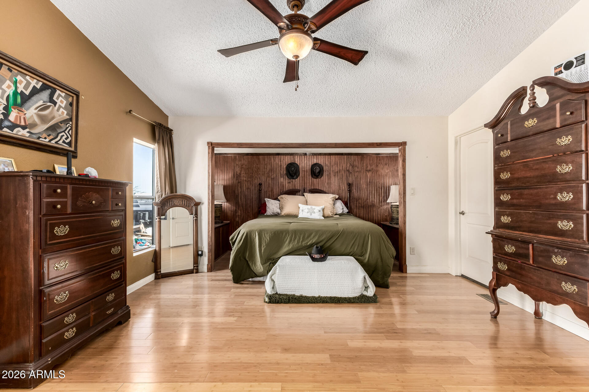 9987 North Geronimo Drive Casa Grande, AZ 85122 - Photo 22 of 53 a bedroom with a bed and a chandelier