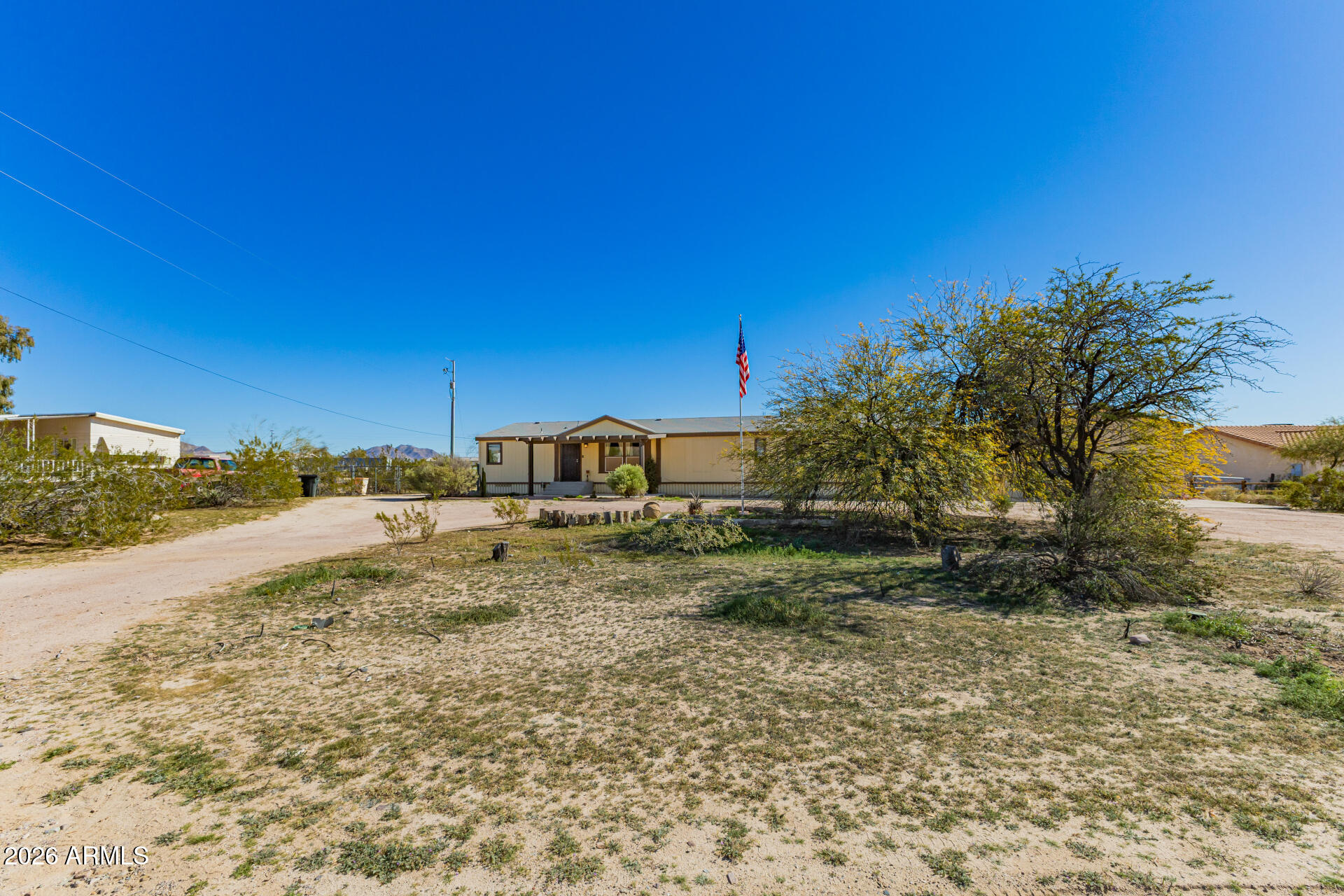 9987 North Geronimo Drive Casa Grande, AZ 85122 - Photo 3 of 53 a view of a yard with an trees