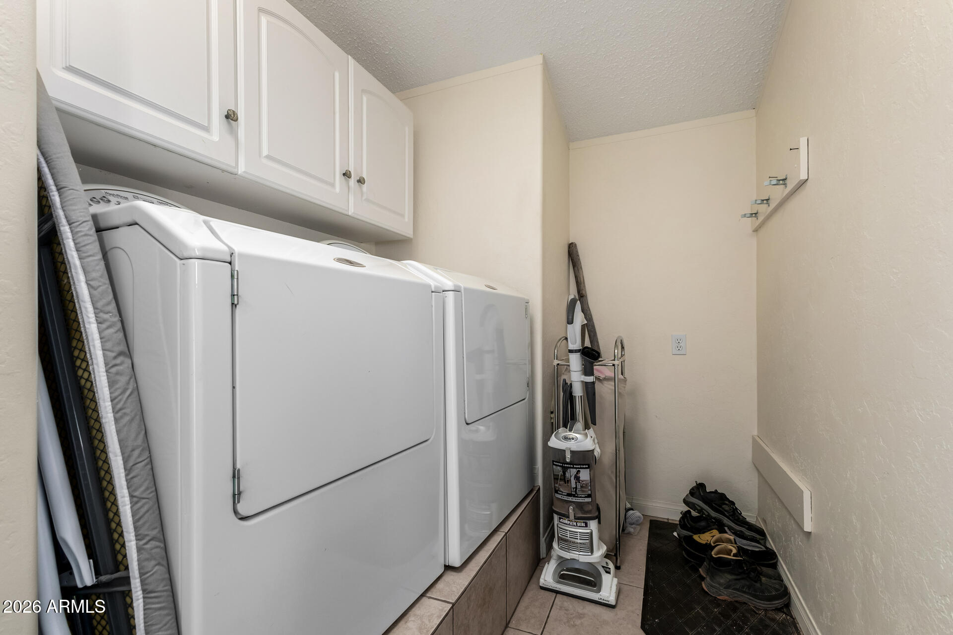 9987 North Geronimo Drive Casa Grande, AZ 85122 - Photo 36 of 53 a kitchen with a refrigerator and cabinets