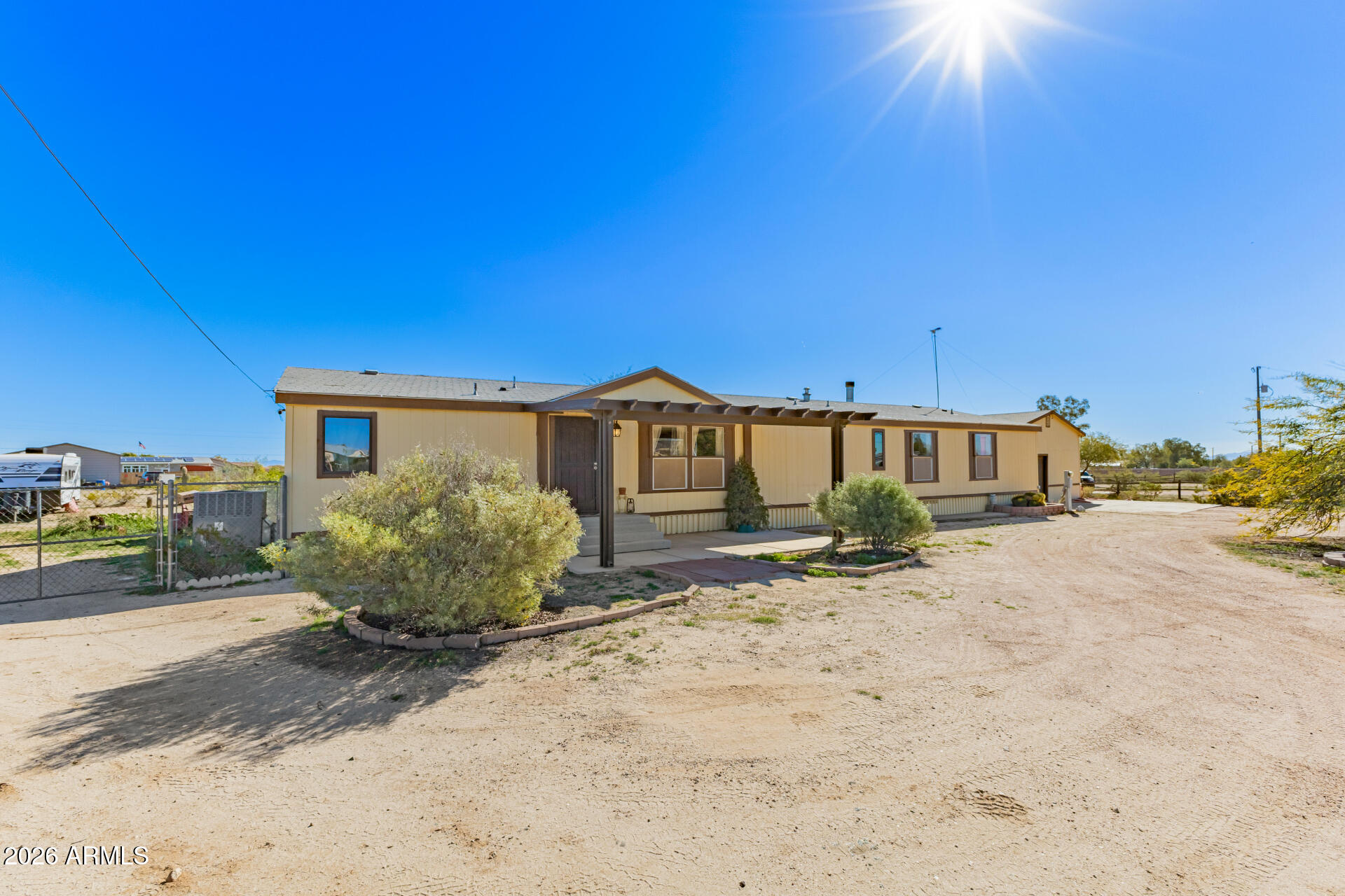 9987 North Geronimo Drive Casa Grande, AZ 85122 - Photo 4 of 53 a front view of a house with a yard