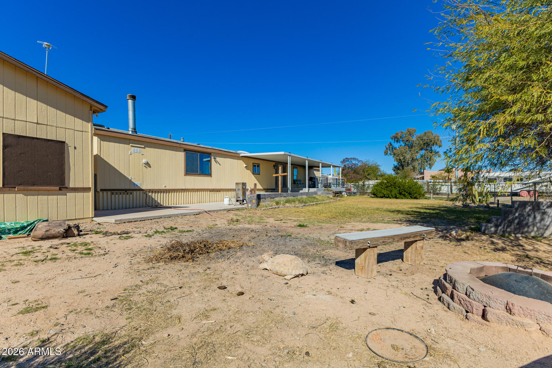 9987 North Geronimo Drive Casa Grande, AZ 85122 - Photo 43 of 53 a view of a backyard with table and chairs