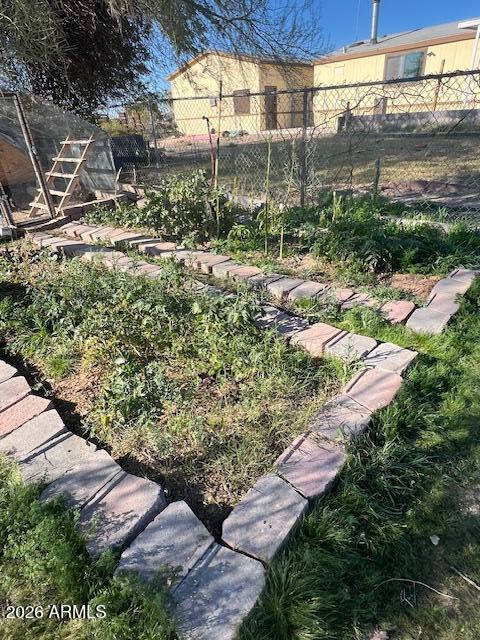 9987 North Geronimo Drive Casa Grande, AZ 85122 - Photo 51 of 53 a view of a yard with plants and a brick wall