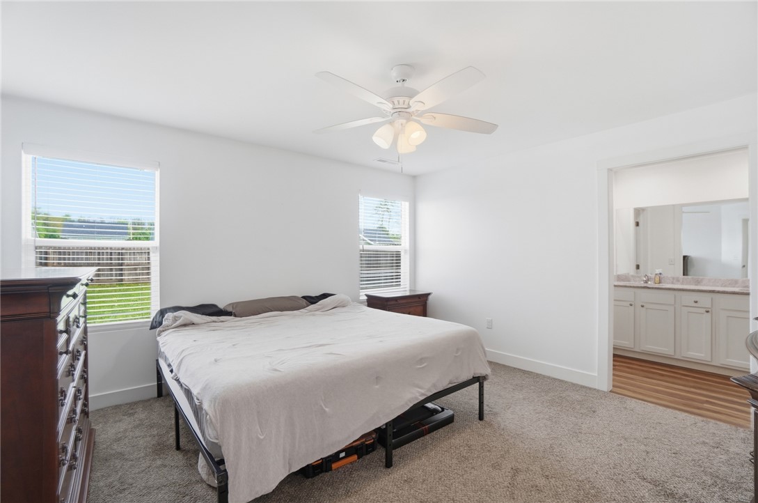 728 East Northern Avenue Springfield, OH 45503 - Photo 16 of 35 Bright and airy, this bedroom provides a tranquil retreat with convenient access to a private bathroom.