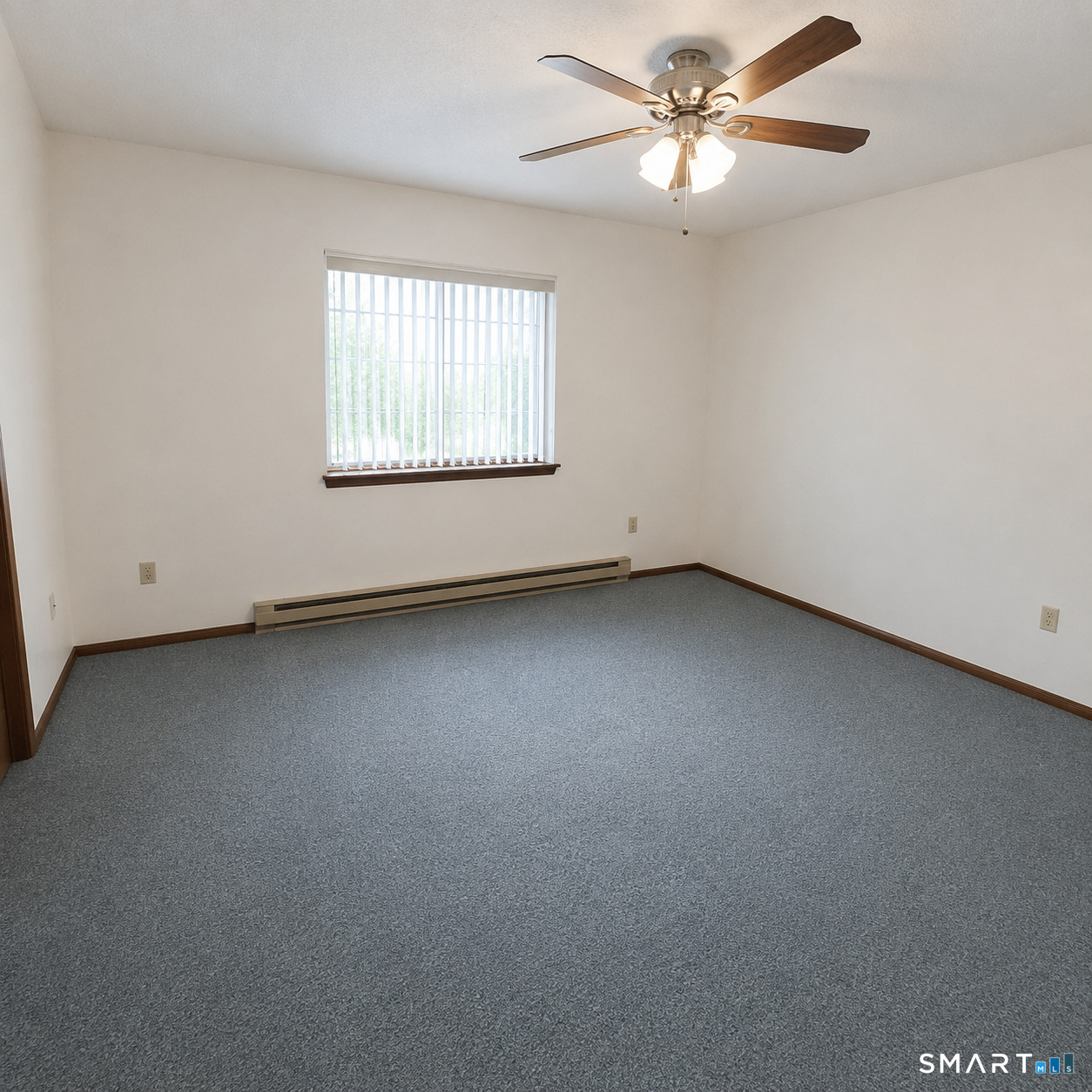 975 Meriden Road, Unit 101 Waterbury, CT 06705 - Photo 25 of 28 an empty room with a window and a ceiling fan
