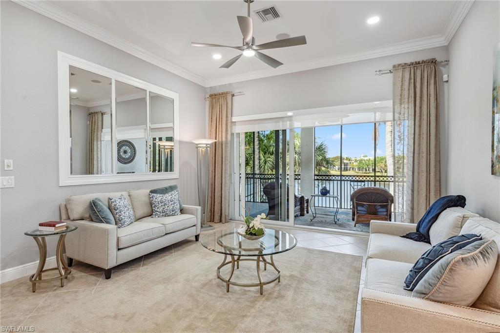 9259 Museo Circle, Unit 201 Naples, FL 34114 - Photo 12 of 50 a living room with furniture and a large window