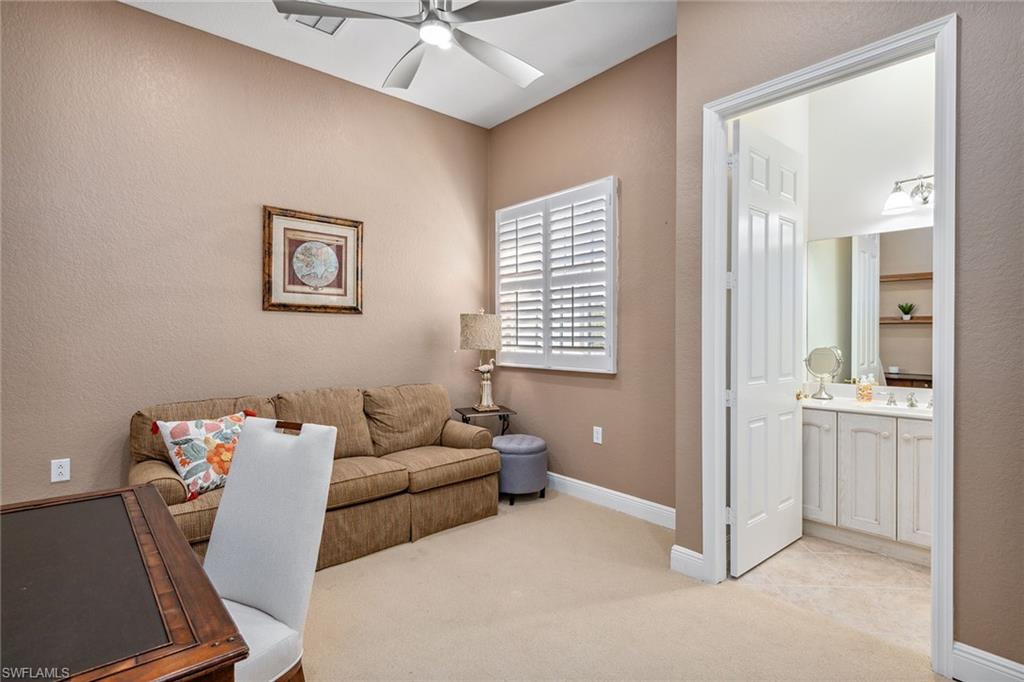 9259 Museo Circle, Unit 201 Naples, FL 34114 - Photo 19 of 50 a living room with furniture and a window