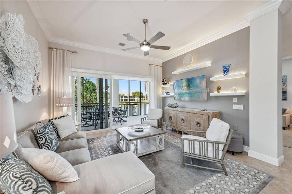 9259 Museo Circle, Unit 201 Naples, FL 34114 - Photo 2 of 50 a living room with furniture and a large window