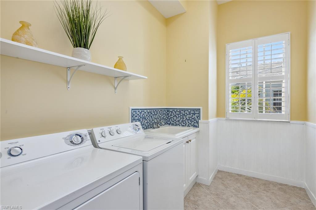 9259 Museo Circle, Unit 201 Naples, FL 34114 - Photo 21 of 50 a utility room with dryer and washer