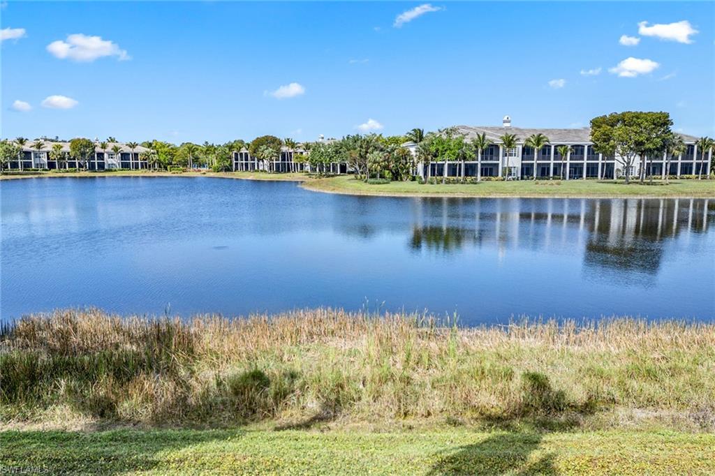 9259 Museo Circle, Unit 201 Naples, FL 34114 - Photo 27 of 50 a view of a lake with a city