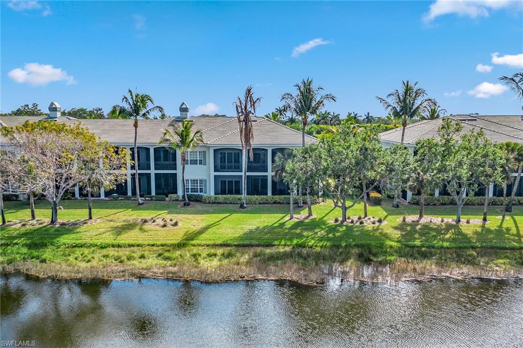 9259 Museo Circle, Unit 201 Naples, FL 34114 - Photo 28 of 50 a view of a house with a yard and sitting area