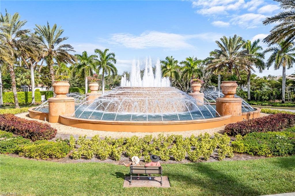 9259 Museo Circle, Unit 201 Naples, FL 34114 - Photo 36 of 50 a view of a swimming pool with a yard and plants