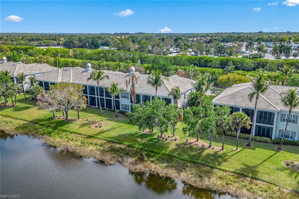 9259 Museo Circle, Unit 201 Naples, FL 34114 - Photo 49 of 50 an aerial view of a house with a garden and lake view