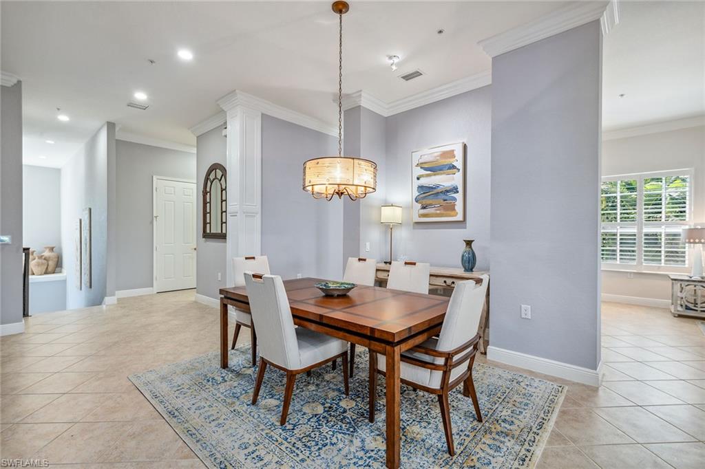 9259 Museo Circle, Unit 201 Naples, FL 34114 - Photo 8 of 50 a dining room with furniture and window