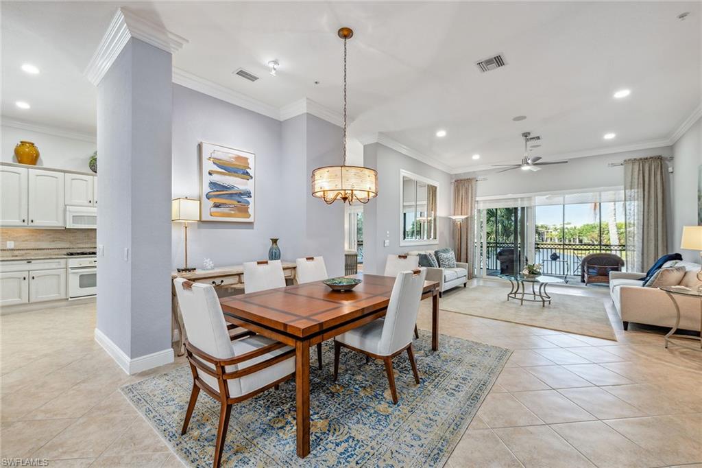 9259 Museo Circle, Unit 201 Naples, FL 34114 - Photo 9 of 50 a view of a dining room with furniture