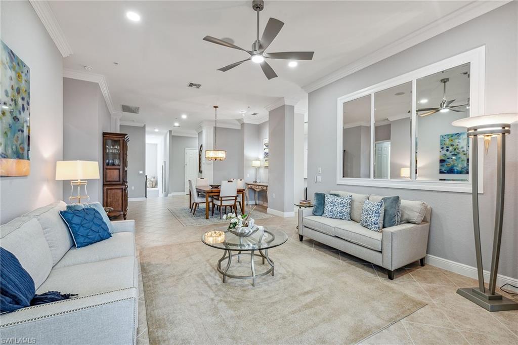 9259 Museo Circle, Unit 201 Naples, FL 34114 - Photo 10 of 50 a living room with furniture and a large window