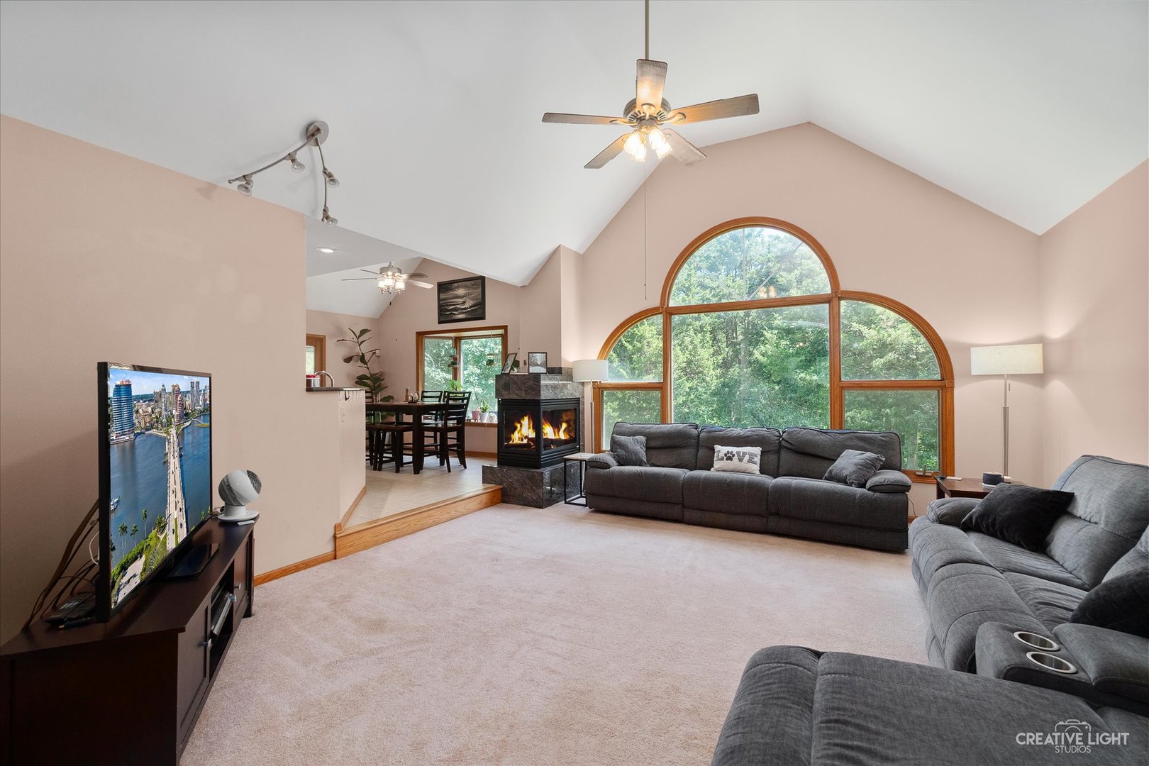 3684 East 2619 Th Road Sheridan, IL 60551 - Photo 6 of 32 a living room with furniture a chandelier and a large window