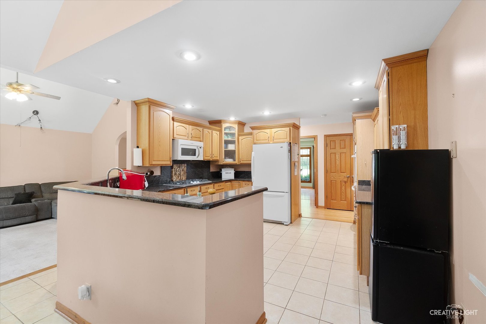 3684 East 2619 Th Road Sheridan, IL 60551 - Photo 9 of 32 a kitchen with stainless steel appliances granite countertop a refrigerator and a sink