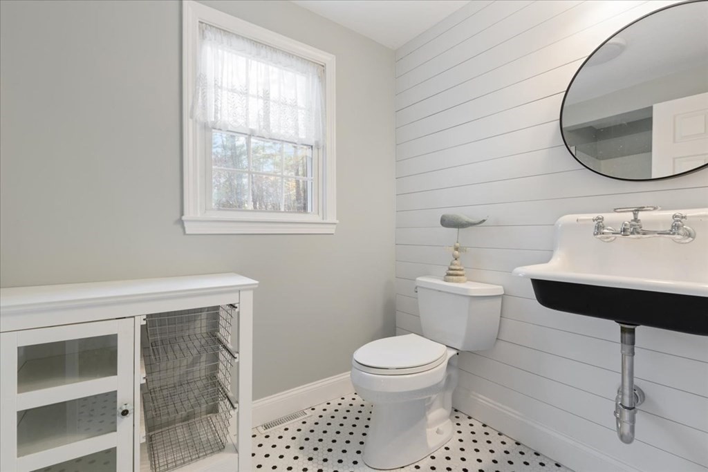 294 County Road Hanson, MA 02341 - Photo 23 of 38 a bathroom with a sink toilet and mirror