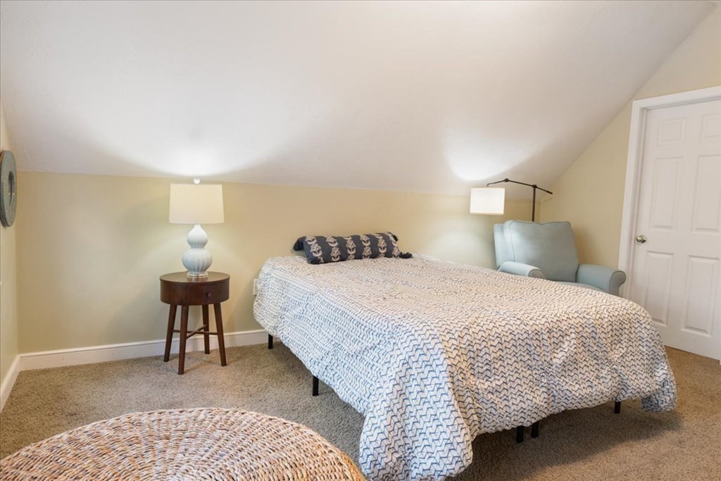 294 County Road Hanson, MA 02341 - Photo 26 of 38 a bedroom with a bed and a lamp