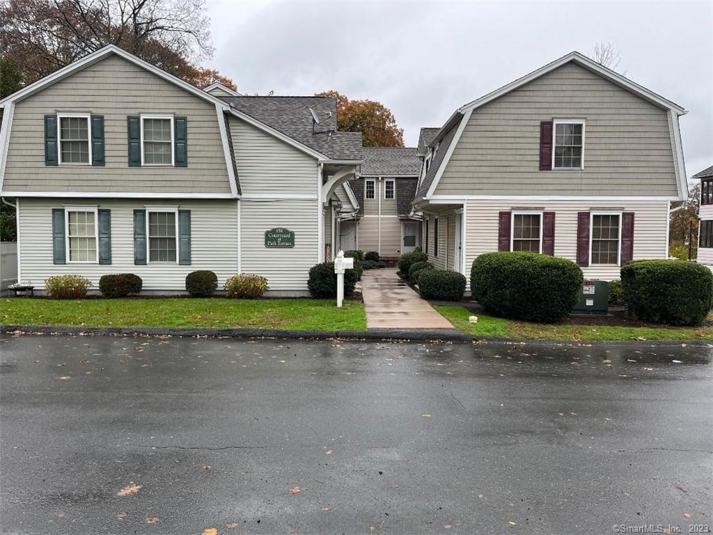 a view of a yard in front view of a house