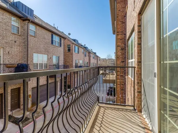 a view of balcony with wooden floor