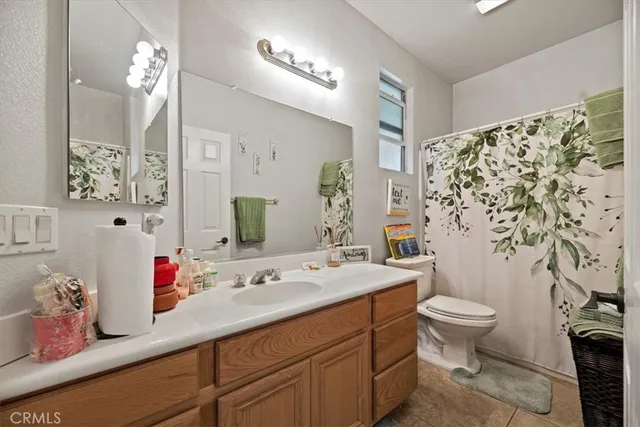 a bedroom with bed and a window