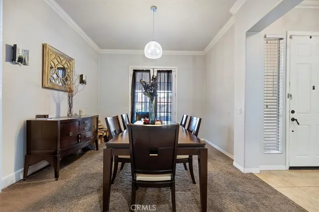 a view of a dining room with furniture and window
