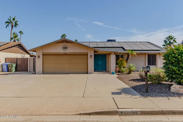 a front view of a house with yard