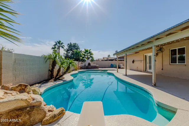 a balcony with table and chairs