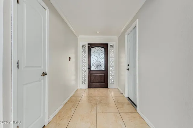 a view of a hallway with a wooden door