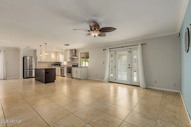 a view of a kitchen with a sink and a refrigerator