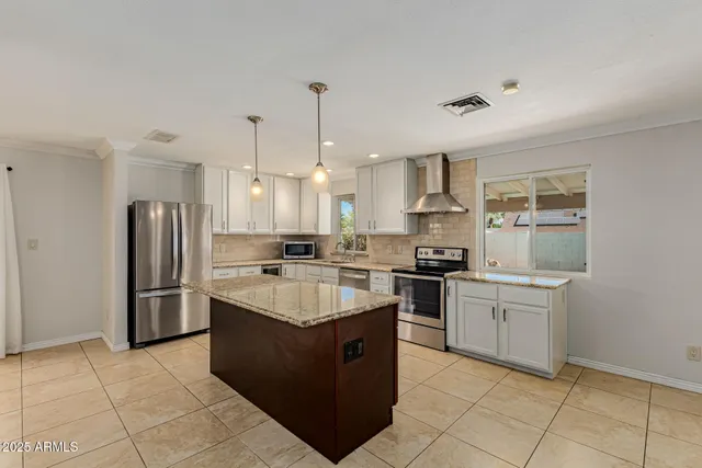 a kitchen with a sink stove and refrigerator