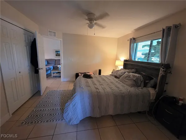 a bed room with a bed and a window