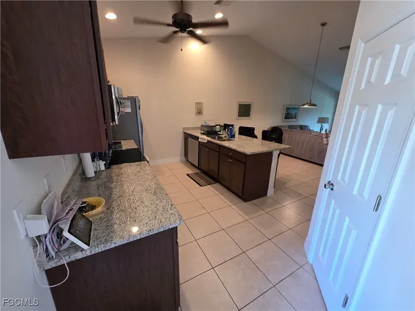 a kitchen with a sink appliances and cabinets
