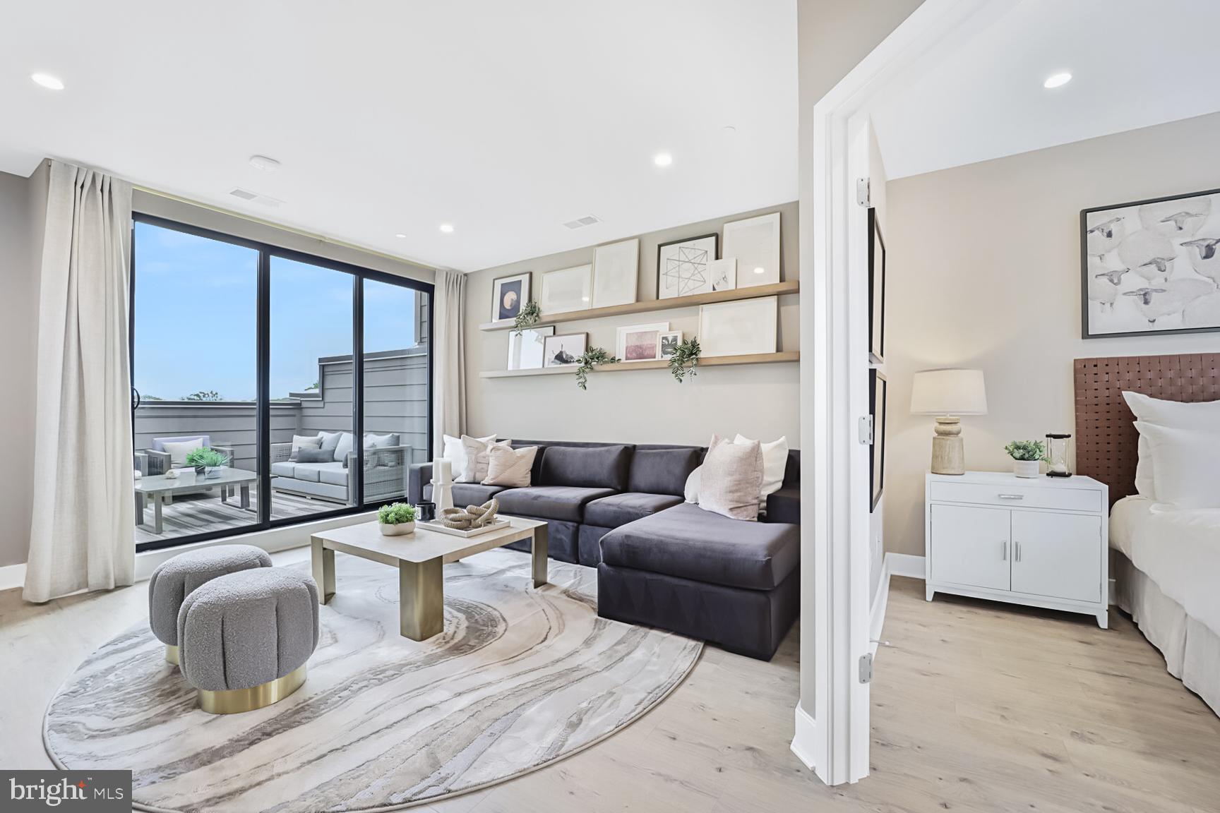 1135 Polaris Road, Unit CAMBRIDGE 78 Potomac, MD 20854 - Photo 4 of 11 a living room with furniture large window and couch