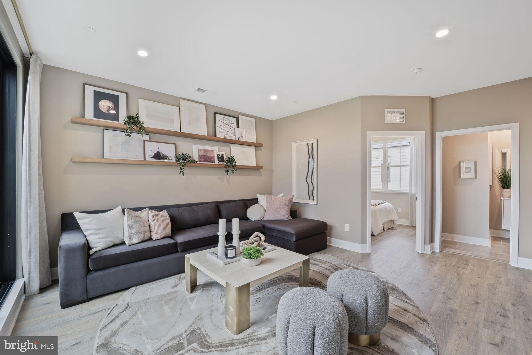 1135 Polaris Road, Unit CAMBRIDGE 78 Potomac, MD 20854 - Photo 5 of 11 a living room with furniture and a view of kitchen