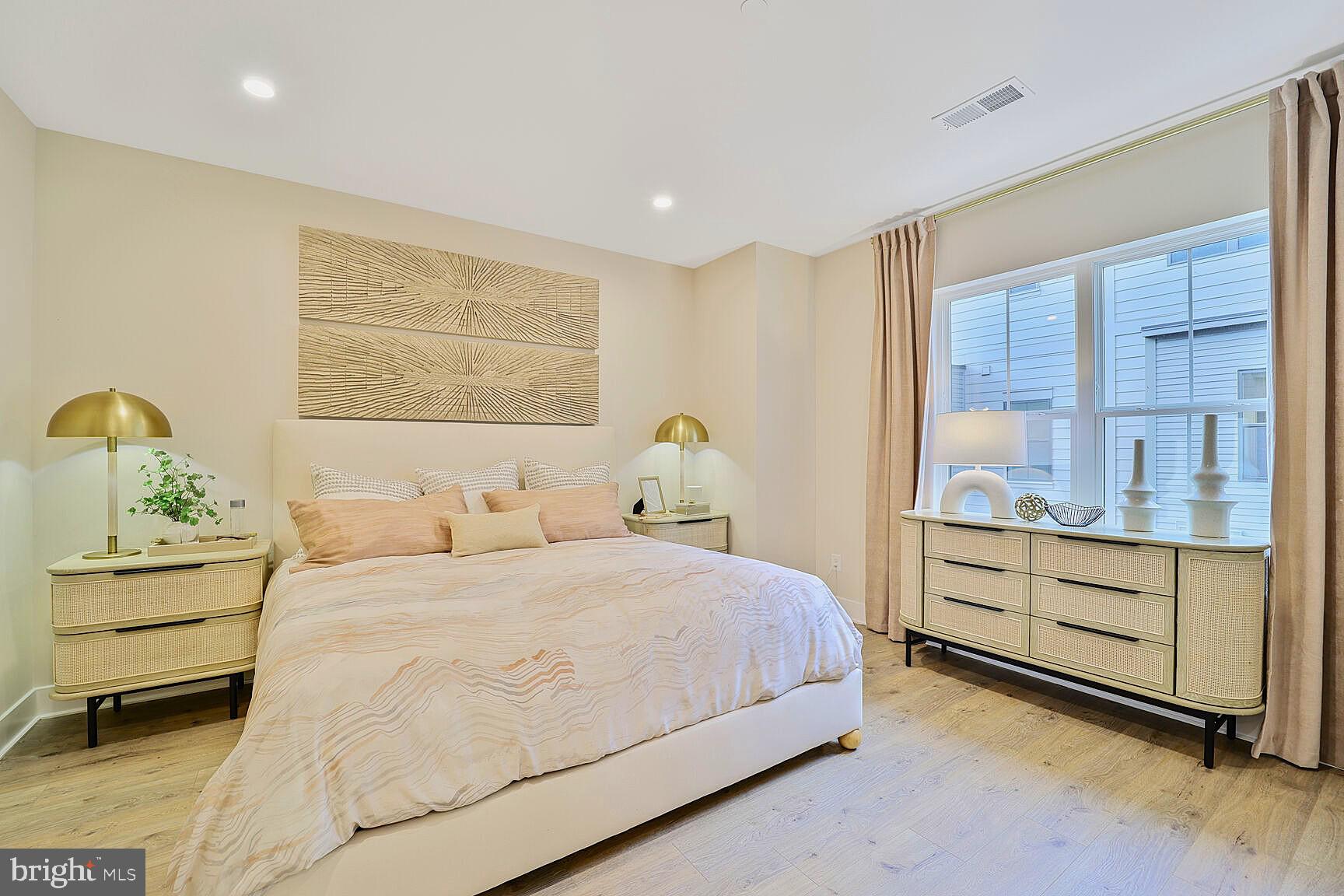 1135 Polaris Road, Unit CAMBRIDGE 78 Potomac, MD 20854 - Photo 7 of 11 a bedroom with a bed and a dresser