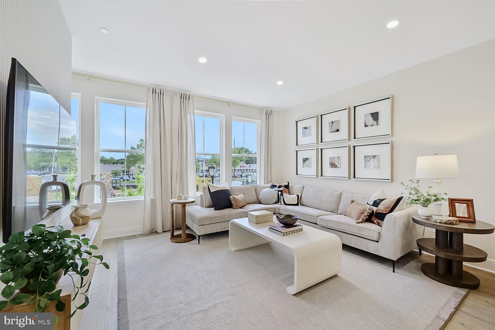 1135 Polaris Road, Unit CAMBRIDGE 78 Potomac, MD 20854 - Photo 10 of 11 a living room with furniture and a large window