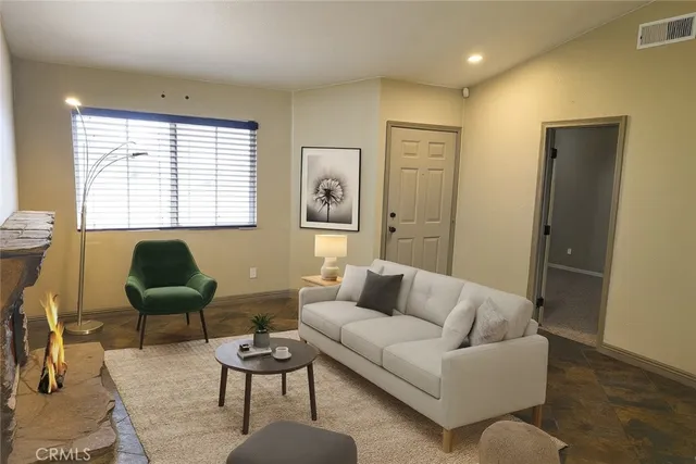 a living room with furniture and a large window