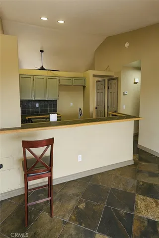 a kitchen with a sink cabinets and wooden floor
